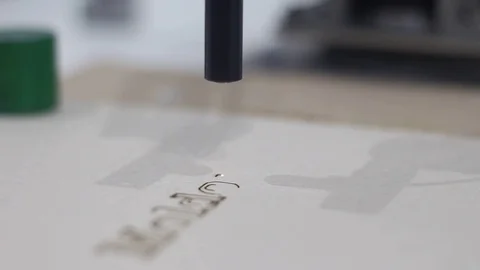 Laser burning text on paper Stock Footage 81786673