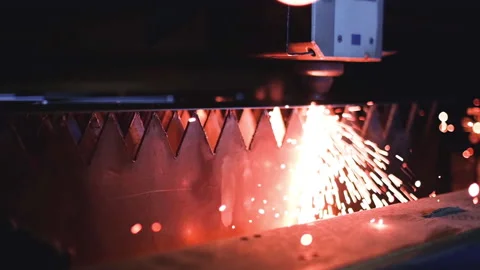Laser CNC cut of metal with light spark. laser cutting metal slow motion Stock Footage 153578204