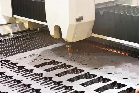 Laser CNC machine cutting of sheet metal. Industry Stock Photos