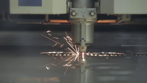 Laser cut metal sheet by machine with sparks in metal wielding work shop Stock Footage 75944880