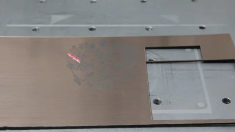 Laser cuts out a pattern of an eagle on metal Stock Footage 161718445