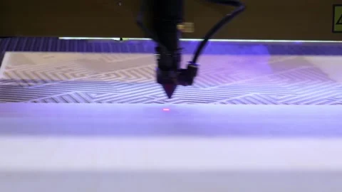 Laser cutter machine engraving intricate geometric patterns onto wood surfa.. Stock Footage 337344543