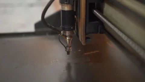 Laser cutter making holes with small diameter in steel plates. CNC laser cutting Stock Footage 129525686
