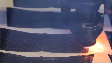 Laser is cutting leather. Laser machine. View through the protective glass. Stock Footage 73418603