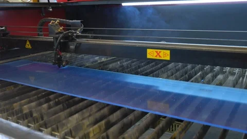 Laser cutting machine carving patterns on the plastic plate Stock Footage 119398190