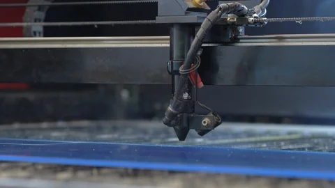 Laser cutting machine carving patterns on the plastic plate Stock Footage 119398242