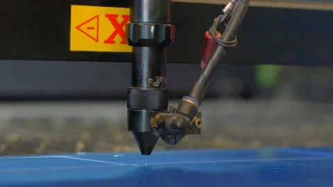 Laser cutting machine carving patterns on the plastic plate Stock Footage 119398249