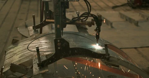 Laser cutting machine cutting through steel close-up Stock Footage 129850056