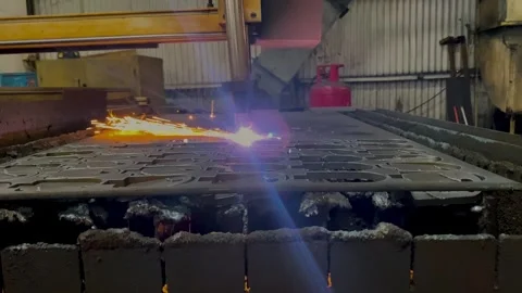 A laser cutting machine for metal plate in a programmed pattern. Video stock 249807628