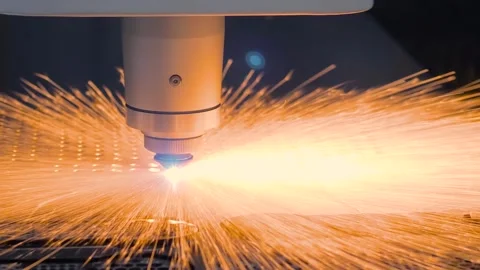 Laser cutting machine is operating on sheet metal with sparks Stock Footage 341852824