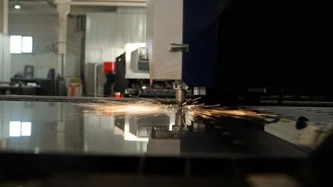 Laser cutting machine processing metal sheet in factory Stock Photos