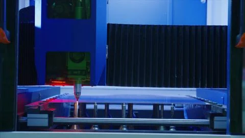 Laser cutting machine processing metal sheet in factory Stock Photos