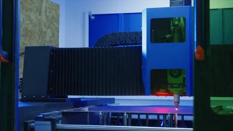 Laser cutting machine processing metal sheet in factory Stock Photos