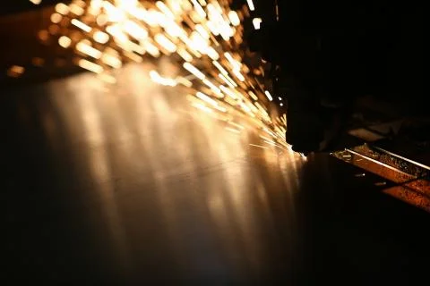 Laser cutting machine with sparkling light Stock Photos