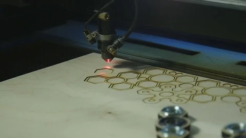Laser cutting machine at work on wood Stock Footage 76392271