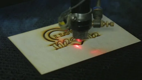 Laser cutting machine at work on wood Stock Footage 76396346