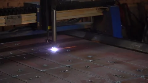 Laser cutting metal sheet into different shapes on production by industrial Stock Footage 233913053