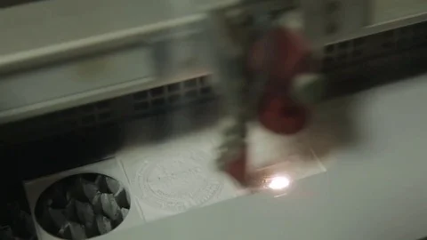 Laser cutting in printing. High precision CNC laser cutting metal sheet Stock Footage 82682148