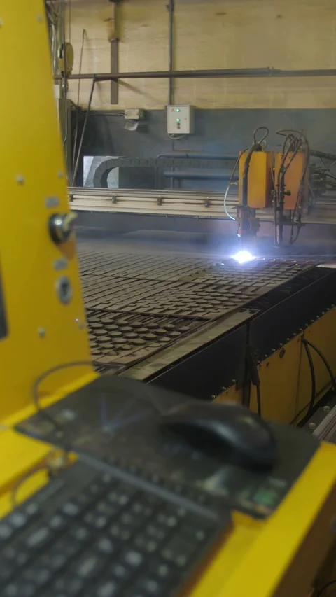 Laser cutting process in an industrial workshop with sparks flying and smoke Stock Footage 312242953