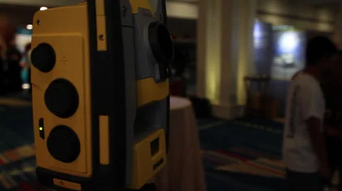 Laser Data Survey Collector Robot (yellow) Standing on Tripod in Conference Hall Stock Footage 58337449