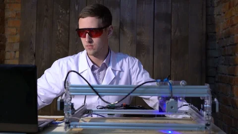 The laser does engraving on the skin. The operator of the laser machine. Stock Footage 87156317