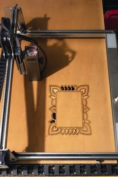 Laser engraving and cutting, using reclaimed wood, upcycling concept Stock Photos