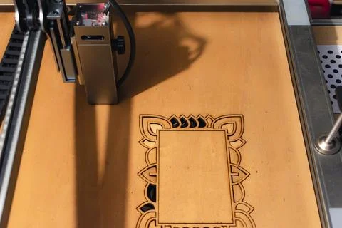 Laser engraving and cutting, using reclaimed wood, upcycling concept 库存照片