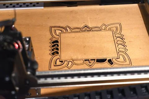 Laser engraving and cutting, using reclaimed wood, upcycling concept Stock Photos