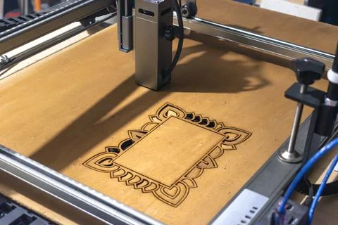 Laser engraving and cutting, using reclaimed wood, upcycling concept Stock Photos