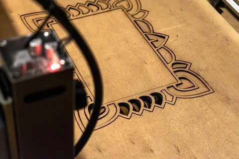 Laser engraving and cutting, using reclaimed wood, upcycling concept 스톡 사진