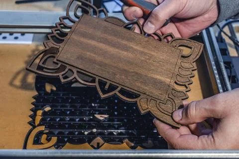 Laser engraving and cutting, using reclaimed wood, upcycling concept Stock Photos