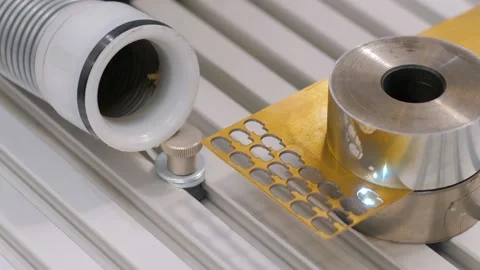 Laser engraving machine burning hole on flat metal sheet: close up Stock Footage 149363038