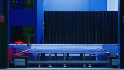 Laser engraving machine processing acrylic sheet in factory Stock Photos