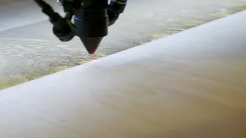 Laser engraving on wood. Laser printer moves on a wooden surface. 库存影片 142017744