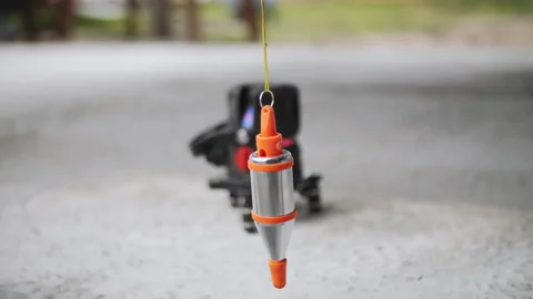 Laser Level and Plumb Bob on Concrete Stock Footage 310781154