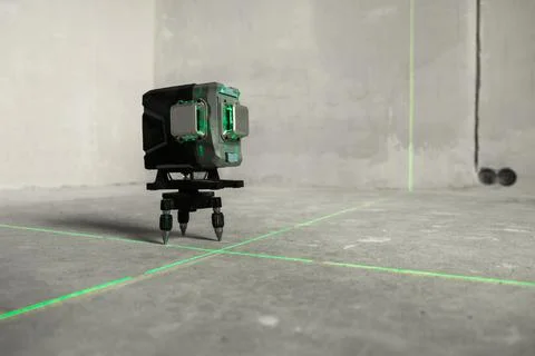 Laser level, construction, finishing work in the room. Laser building level with Stock Photos