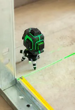 Laser level measuring tool in construction site. Stock Photos
