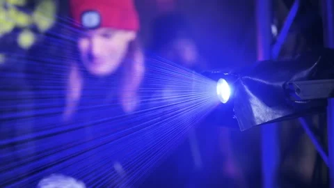Laser Light Beams Cutting Through Fog At Night Show With Watching Crowd Stock Footage 324944738