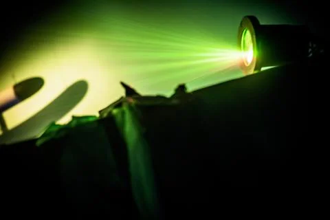 Laser Light show in the dark with bright green rays Stock Photos