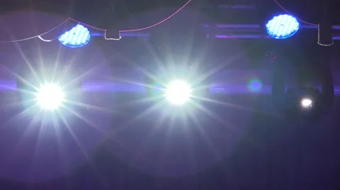 Laser lights move and shine on the stage of the concert hall at the disco Stock Footage 68441264