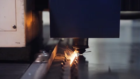 Laser machine cuts curved lines on metal. Stock Footage 108648291