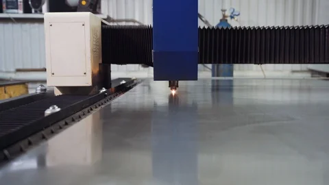 Laser machine cuts a sheet of metal into small pieces. Stock Footage 108648356