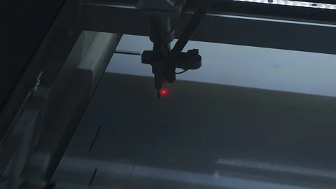 Laser machine in operation - cutting plexiglas for social distancing Stock-Footage 129393209