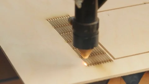 Laser machine processes plywood Stock Footage 79026314