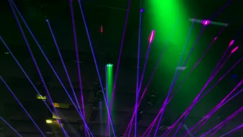Laser neon music light rays flash and glow in the banquet hall. 4K Video stock 150228506