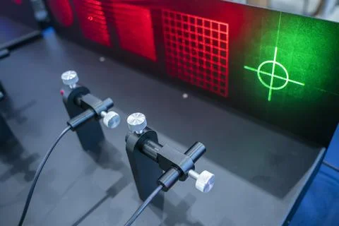 Laser on optical table in physics laboratory Stock Photos