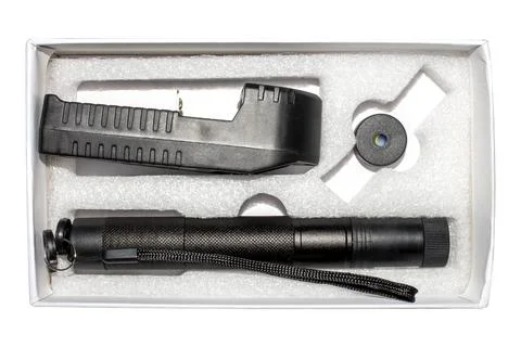 A laser pointer on a white background.A pointer with a green laser. Stock Photos