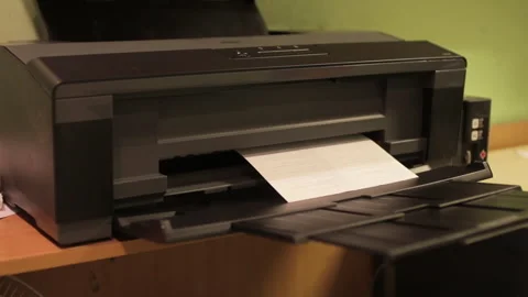 Laser Print machine printing documents in office. The process of printing on Stock Footage 261388562