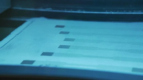 Laser printing a pattern on cloth Stock Footage 99054573
