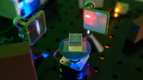 Laser in a quantum optics lab. Semiconductor laser on optical table in a quan Stock Footage 126298660